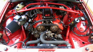 Illustration for article titled For $28,000, This 1987 Alfa Romeo Milano Is Ready To Race